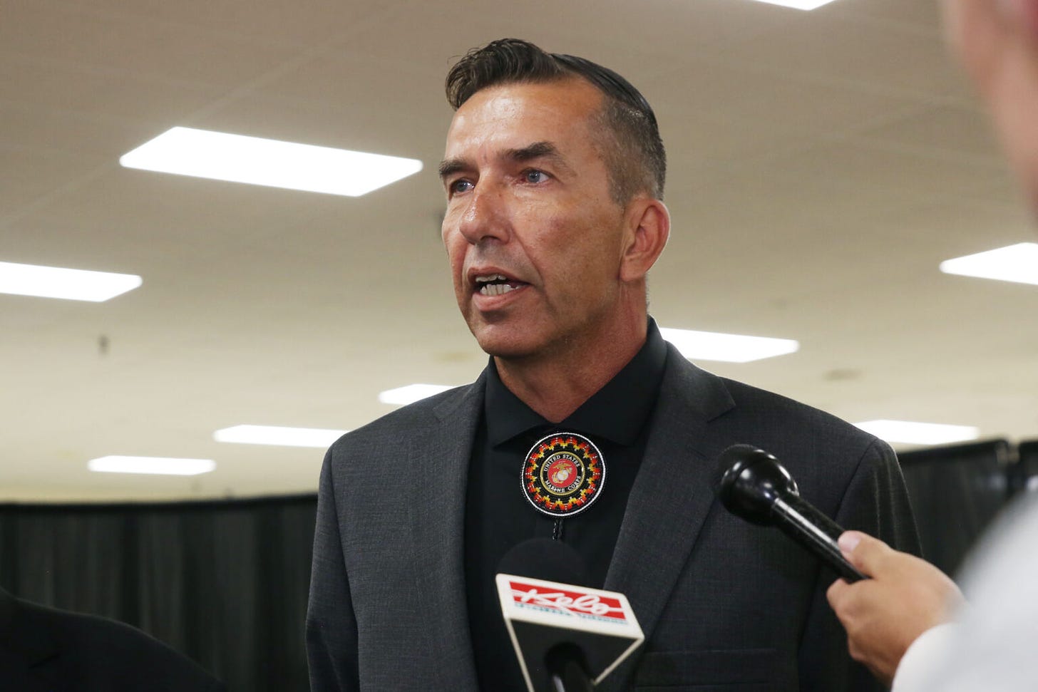 Crow Creek Sioux Tribe Chairman Peter Lengkeek takes media questions after a roundtable about public safety on tribal lands with Sen. Mike Rounds, U.S. Attorney General Merrick Garland and other tribal leaders on Aug. 14, 2024, in Wagner. (Makenzie Huber/South Dakota Searchlight)