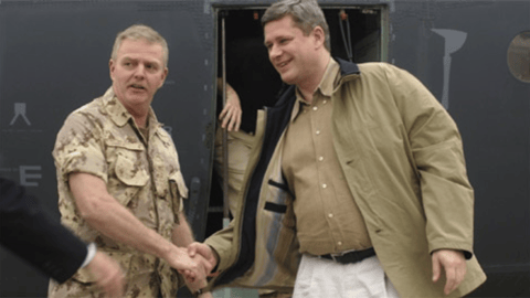 General Rick Hillier greets then-Prime Minister Stephen Harper as he arrives in Afghanistan in March 2006, not long after his election as PM. Today, the retired Hillier says Canada is on "a downward spiral." Linda Slobodian asks him why he says that