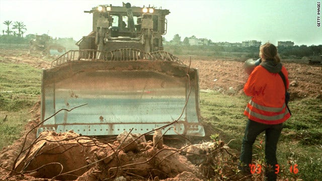 American peace activist Rachel Corrie, 23, tries to stop an Israeli bulldozer from destroying Palestinian land March 16, 2003.