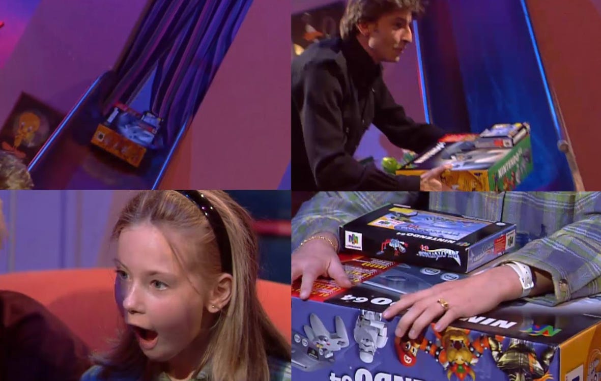 Foto's van 7-jarige Amy die van Koen Wauters een Nintendo 64 met Pilot Wings ontvangt.