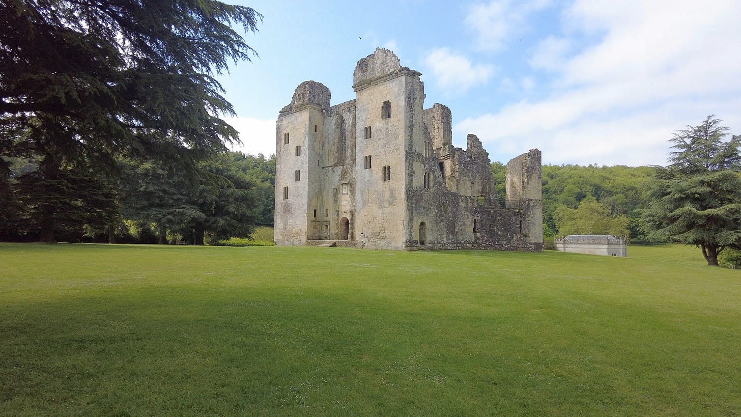 Wardour Castle in Wiltshire. The ruins are managed by English Heritage. The castle still has the front entrance intact as we can see in this photo and is surrounded by beautiful trees.