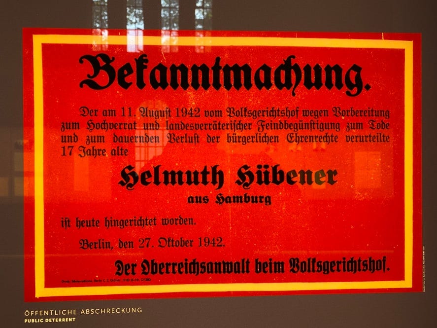 A red sign with black text
Description automatically generated A red sign with black text
Description automatically generated