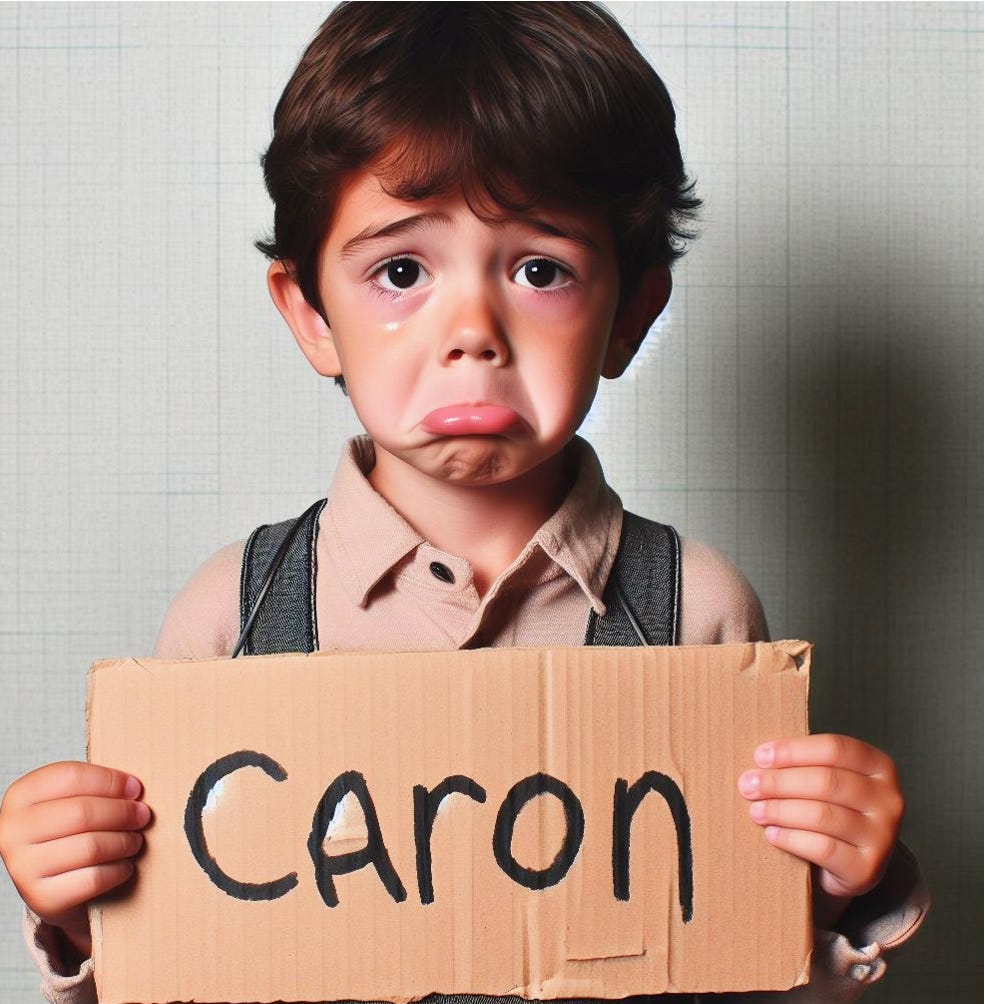 Sad boy with 'Caron' sign