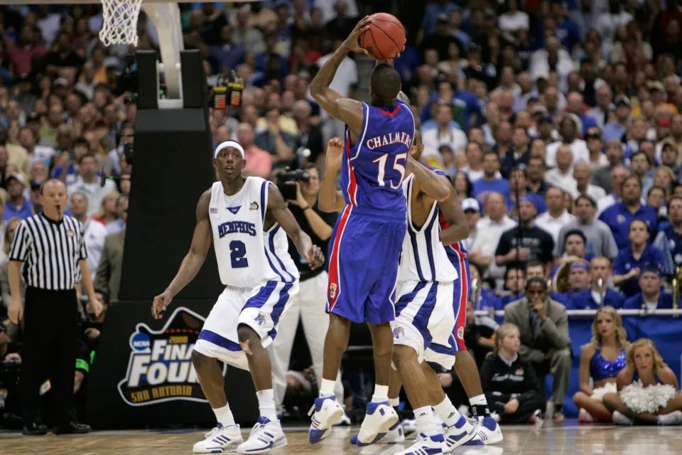 FILE - In this Monday, April 7, 2008, file photo, Kansas' Mario Chalmers shoots a three pointer to take the game in to overtime against Memphis during the championship game at the NCAA college basketball Final Four in San Antonio. Kansas defeated Memphis 75-68 in overtime. (AP Photo/Mark Humphrey, File)