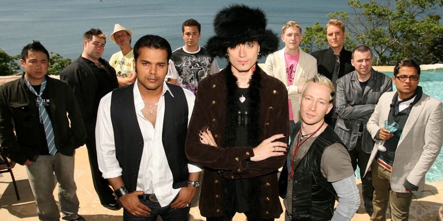 a promotional photo from the failed pickup artist reality show, "the pickup artist," featuring misogynistic creep "Mystery" wearing a fluffy top hat