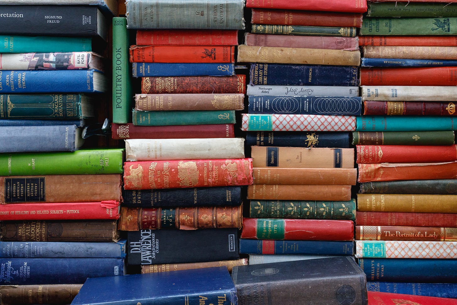 A colorful pile of hardback books