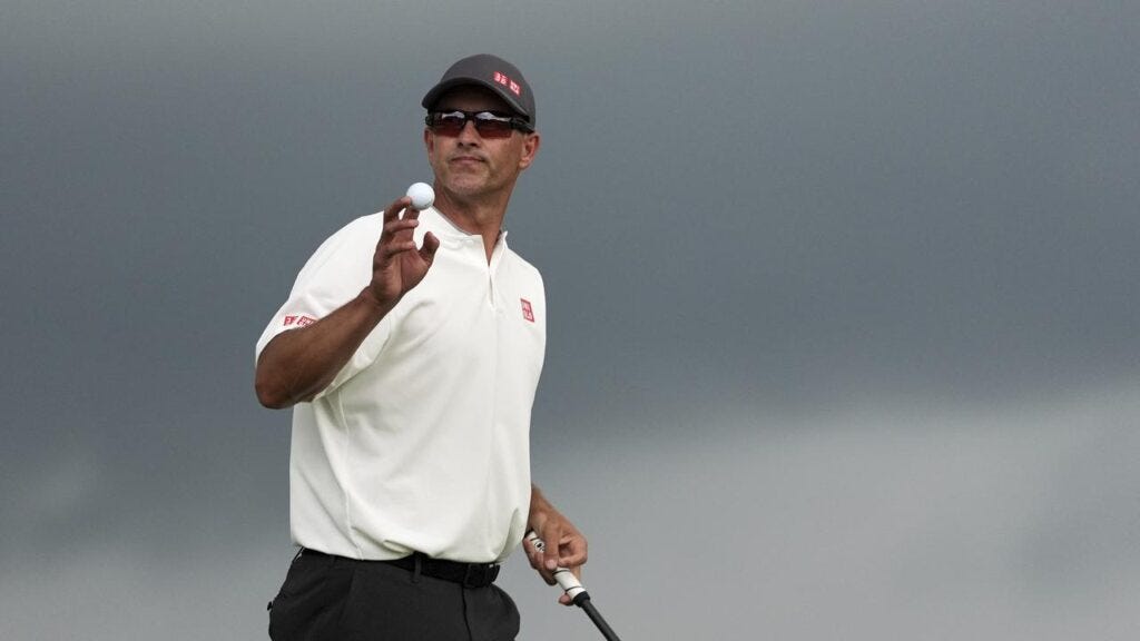 Adam Scott was battling for the US Open title when a storm forced a suspension of play at Oakmont.

