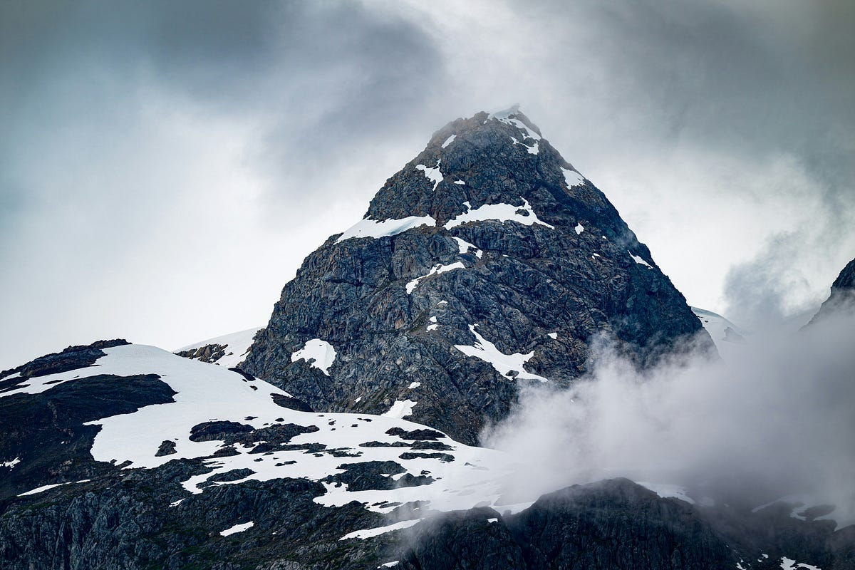 A steep mountain hill representing the challenges of modern life A steep mountain hill representing the challenges of modern life