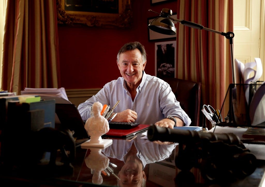 Phil Cleary sitting at a desk, smiling. Phil Cleary sitting at a desk, smiling.