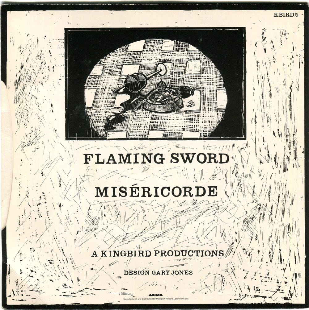 Reverse of the Flaming Sword single sleeve. It names the two songs Flaming Sword and the Misericorde, and states "A Kingbird Productions".