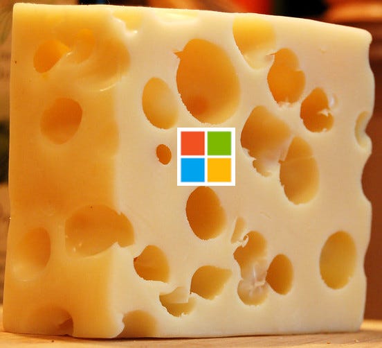A piece of Swiss cheese (which has the holes in it one usually expects to see in Swiss cheese) with a Microsoft logo on it