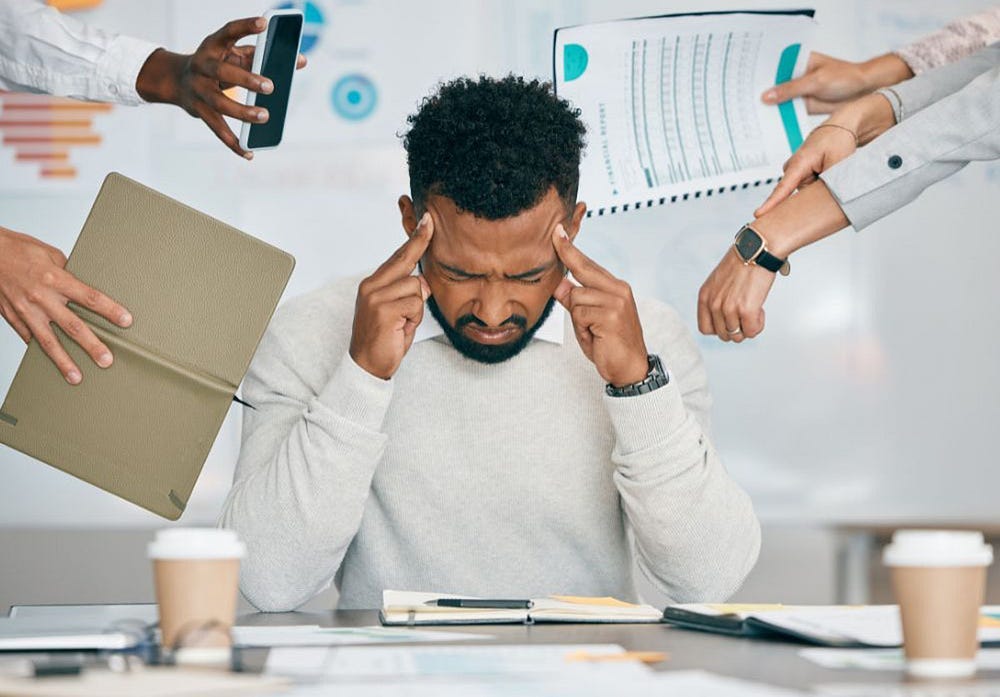 man stressed out at work