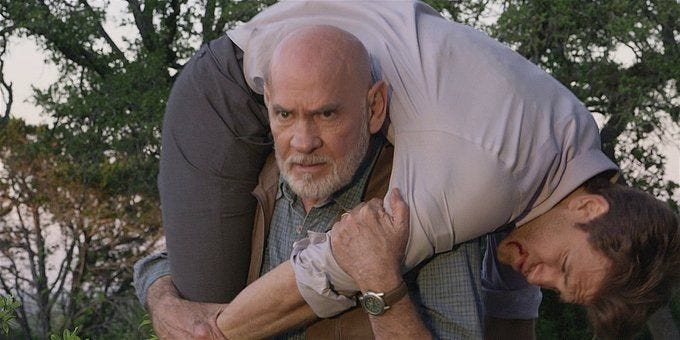 Walker Bonham carries an injured gay Liam over his shoulders 1.13.