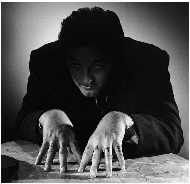 Promo portrait of Robert Mitchum for "The Night of the Hunter" (1955)