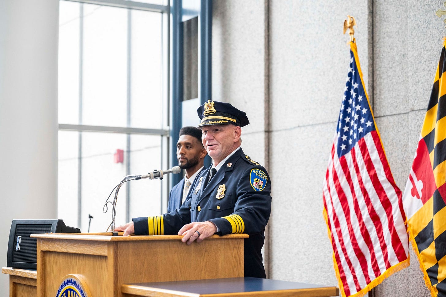 May be an image of 1 person and text that says 'BALTIMORE' May be an image of 1 person and text that says 'BALTIMORE'