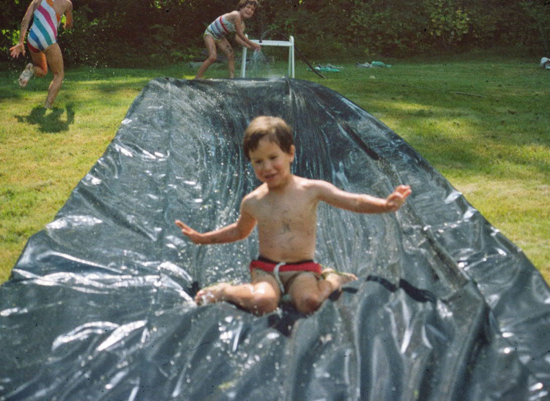 Boy sliding on plastic