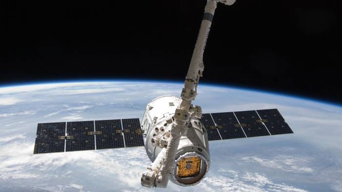 The Dragon SpaceX satellite in space