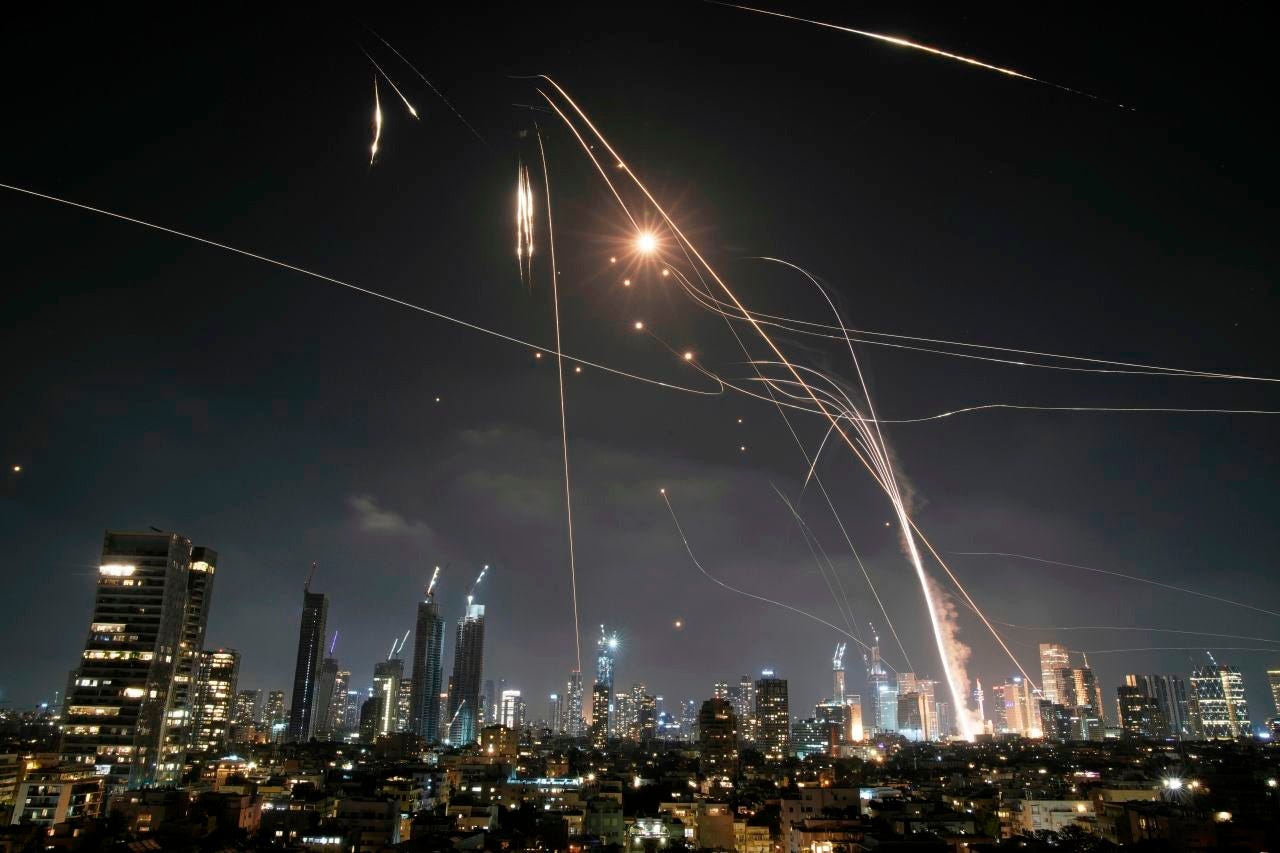 Israeli Iron Dome air defense system fires to intercept missiles over Tel Aviv, Israel, on Friday.