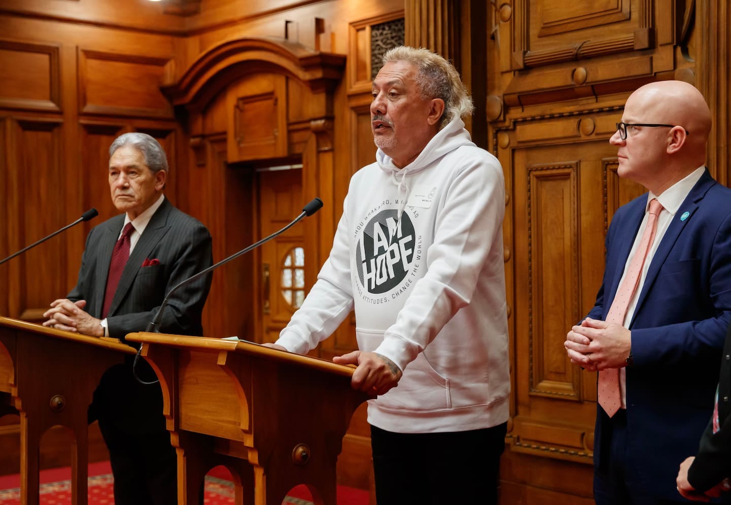 Mike King with Deputy Prime Minister Winston Peters and Mental Health Minister Matt Doocey after the pre-Budget announcement of a $24 million boost for Gumboot Friday. Photo / Mark Mitchell  