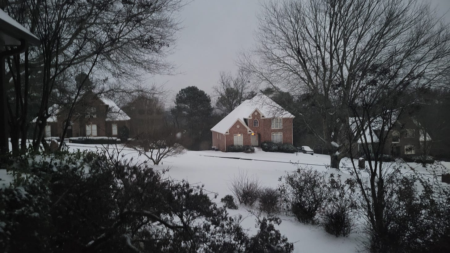 snow on brick house