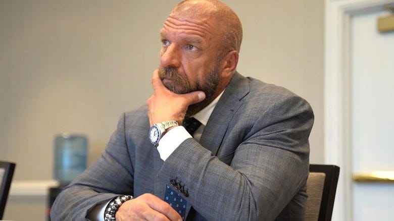 Triple H thinking in a meeting 