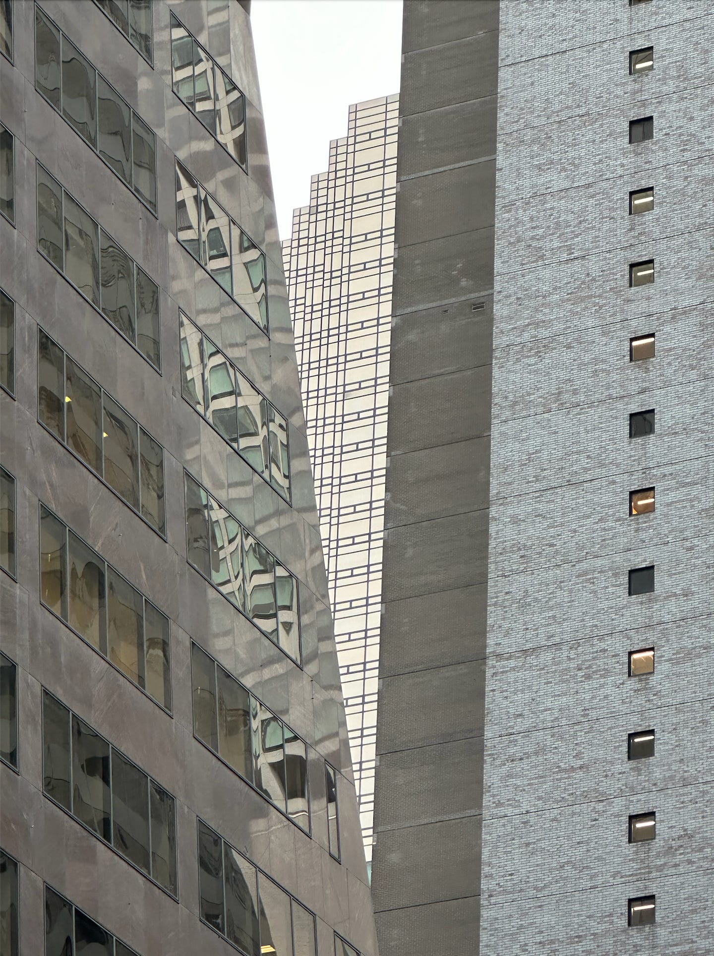 Reflective Manhattan skyscrapers viewed from Madison Ave near 53rd