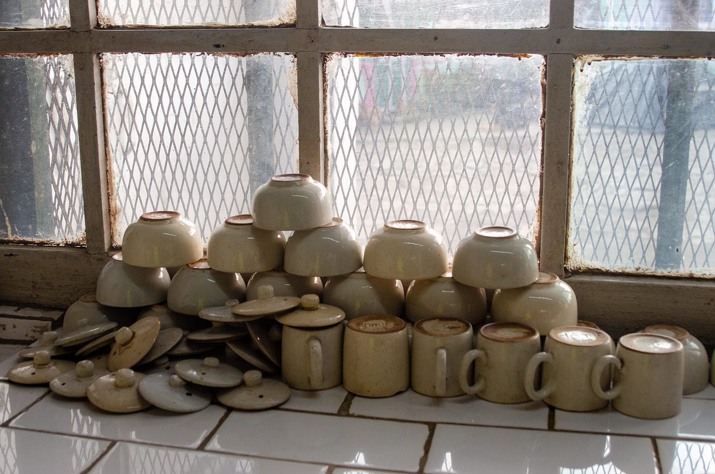 ID: Tea cups and bowls stacked up