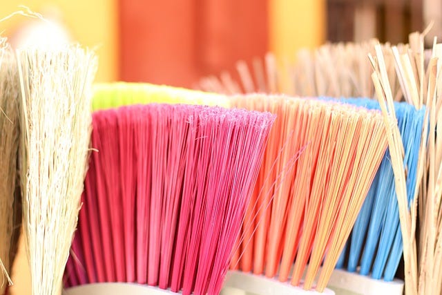 brooms of different colors