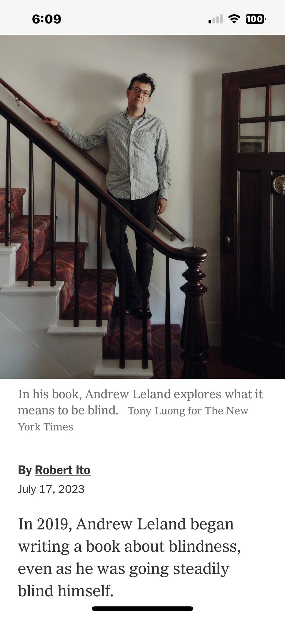 A screenshot of the New York Times profile linked below, with a photo of Andrew Leland standing on a flight of stairs that I will tell you are the stairs in my house ok