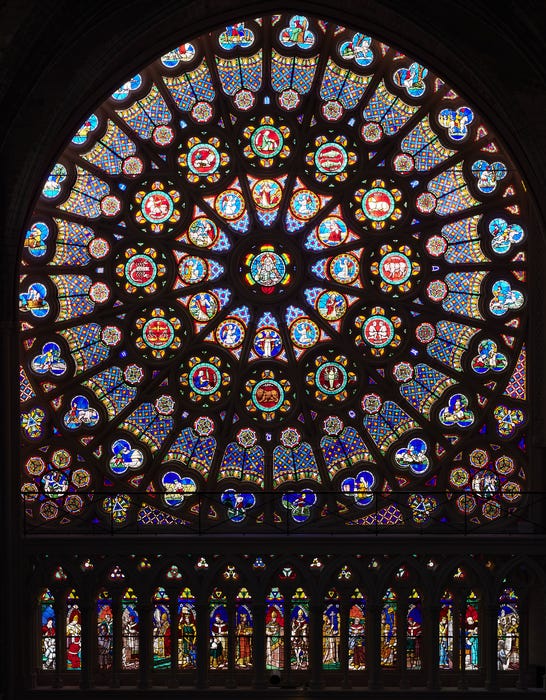 Colored rose Window in transept (south) of the Saint-Denis cathedral. Perfect Gothic Geometry.