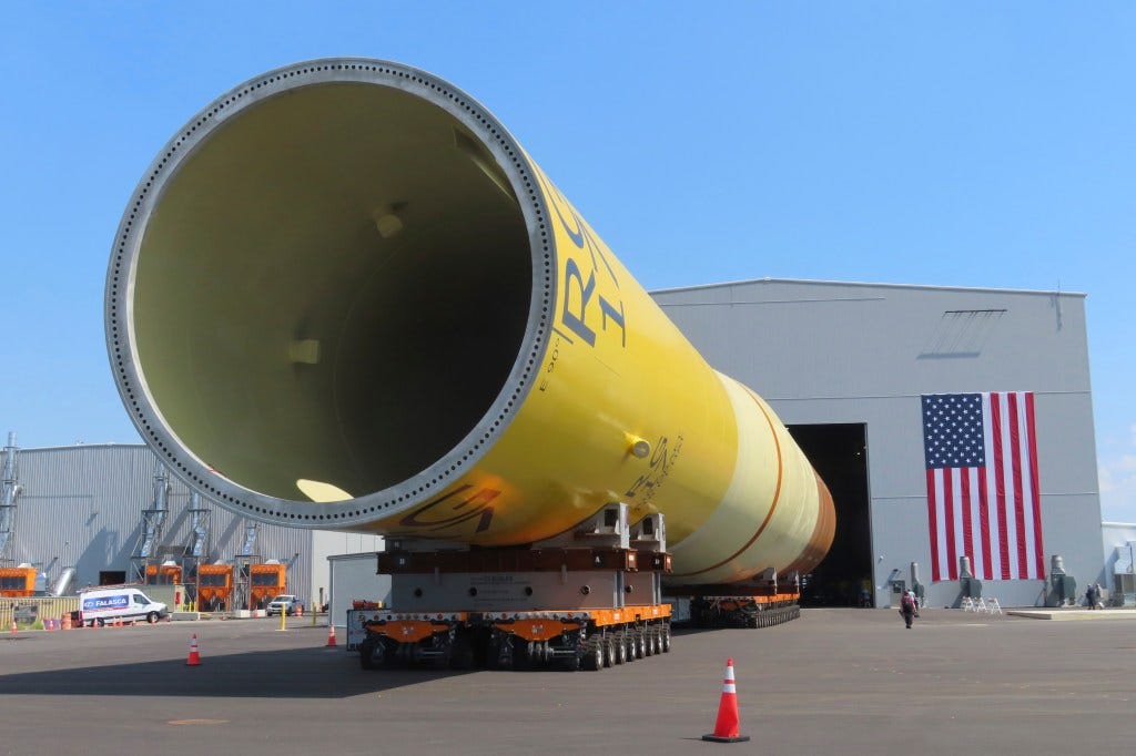 Part of a foundation for an offshore wind turbine rests on rollers outside a manufacturing facility in Paulsboro, N.J. 