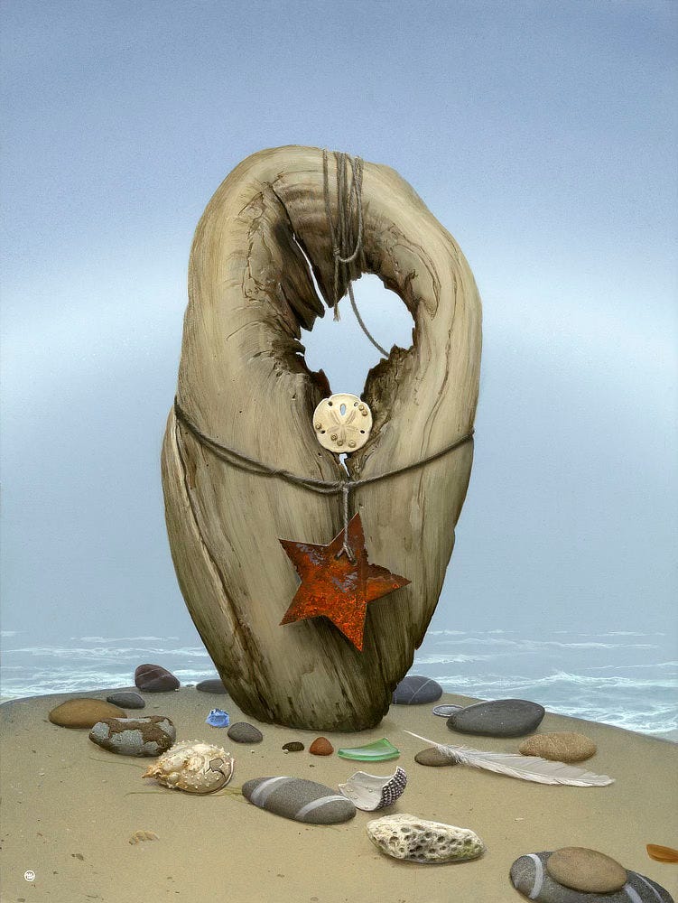 A knot of driftwood stands upright on the beach backed by mist and low frothy waves. An arc of silver set against the gray-blue mist forms a fogbow. The surface of the weathered wood is smooth but cracked in places, and there's an asymmetrical hole at the top that shows through to the sky. A sand dollar shell is wedged at the bottom of that gap. Below it, hanging by rope wrapped around the girth of the totem, is a rusty 5-pointed star. A variety of smooth rocks are laid out on the smooth wet sand. Among them are a green shard of glass, an ivory conch shell, and a white feather.