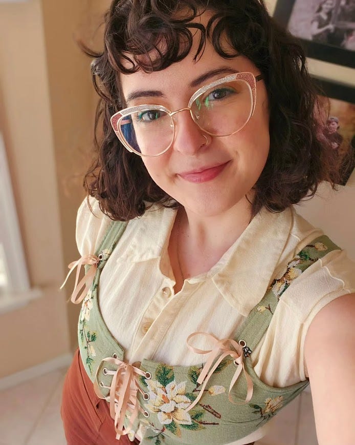 Selfie of Kate wearing a Ren Faire-esque corset shirt