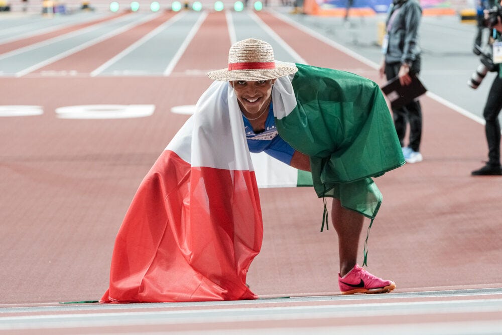 Italian hurdler Lorenzo Simonelli celebrates a silver medal with Luffy’s straw hat and the gear 2 pose.