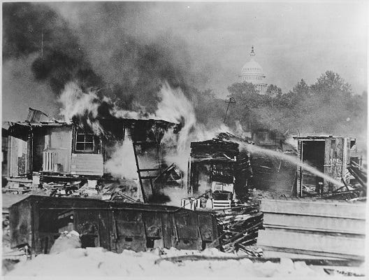 Bonus Army shacks go up in flames after the U.S. Army evicts protesters on the night of July 28, 1932. The dome of the Capitol Building is visible in the distance. (National Archives)