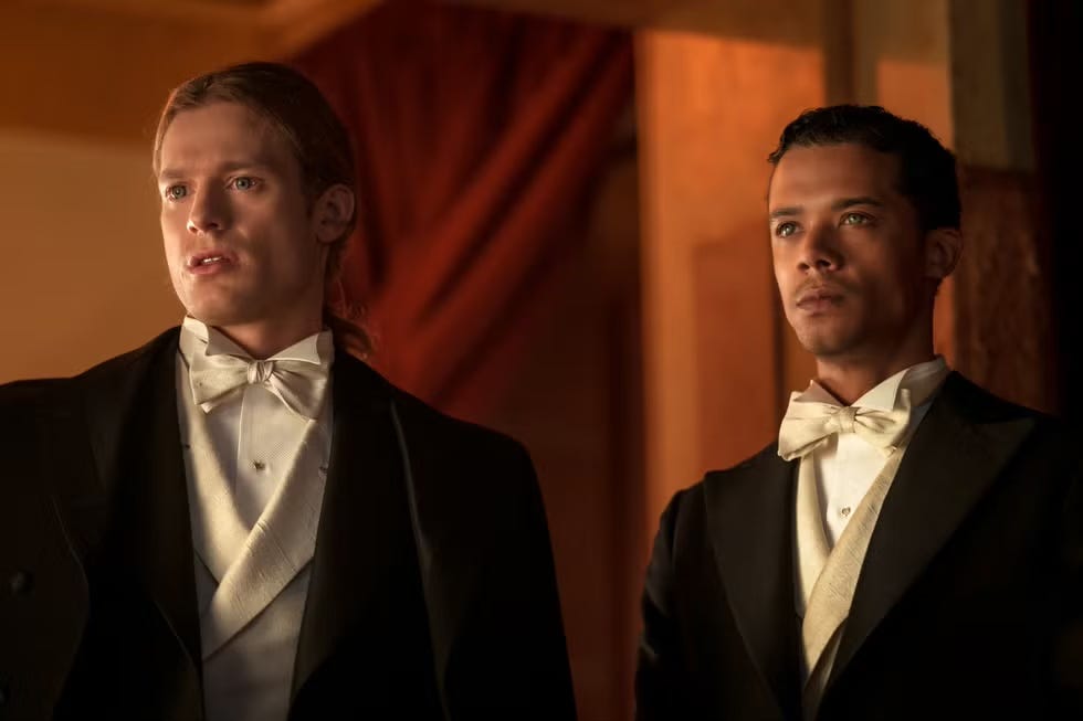 Sam Reid as Lestat and Jacob Anderson as Louis in Interview with the Vampire, boith characters in white tie at the opera