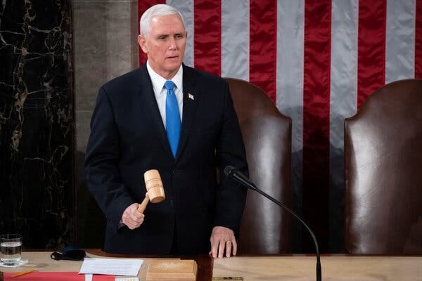 Mike Pence standing at a lectern and holding a gavel.