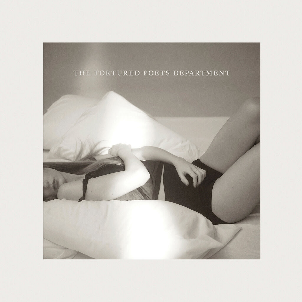 The album cover for Taylor Swift’s “The Tortured Poets Department,” which depicts the star lying on pillows in sleepwear, draping her arms over her body.