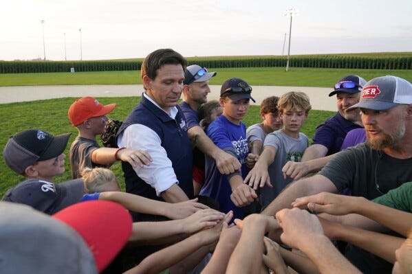 Far away from Trump's jail drama, Ron DeSantis and his family head to Iowa's  'Field of Dreams' | AP News