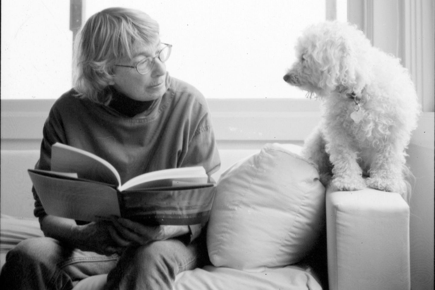 Image of Mary Oliver with her dog. Image of Mary Oliver with her dog.