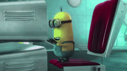 A minion furiously types at a computer.
