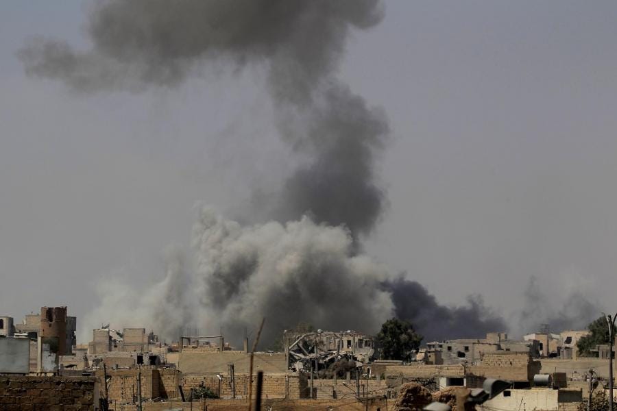 Syria: Smoke rises after an air strike during fighting between members of the Syrian Democratic Forces and Islamic State militants in Raqqa