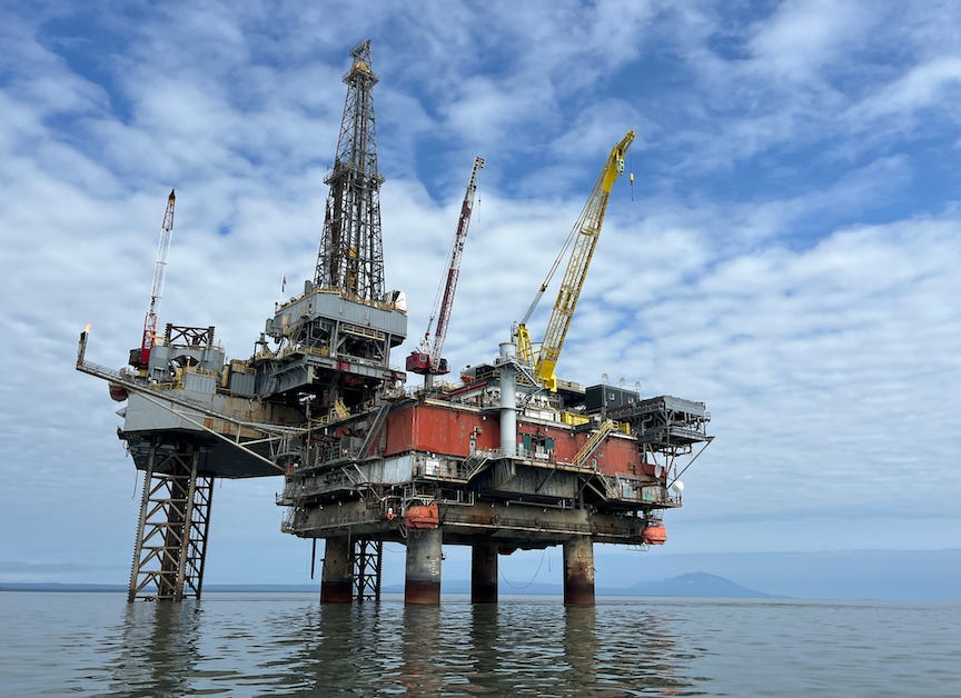 A specialized unit called a jackup rig, at left, drilled a natural gas well last year at Hilcorp’s Tyonek platform, right, in Cook Inlet. (Nathaniel Herz for Alaska Public Media)