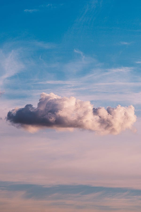 A large cloud in the blue sky.