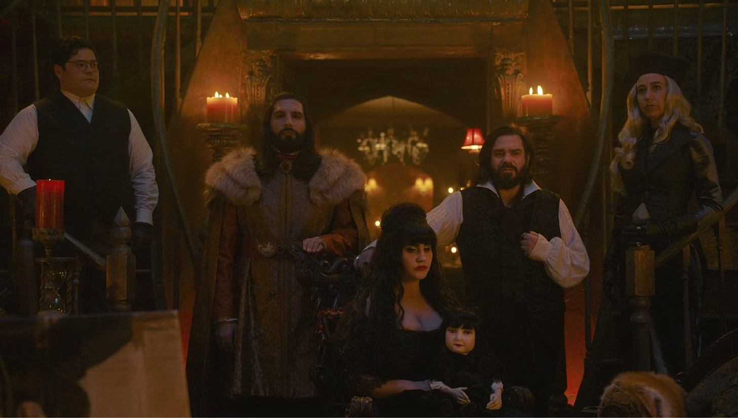 Guillermo, Nando, Nadja, Laszlo, and the Guide stand for a portrait in What We Do in the Shadows