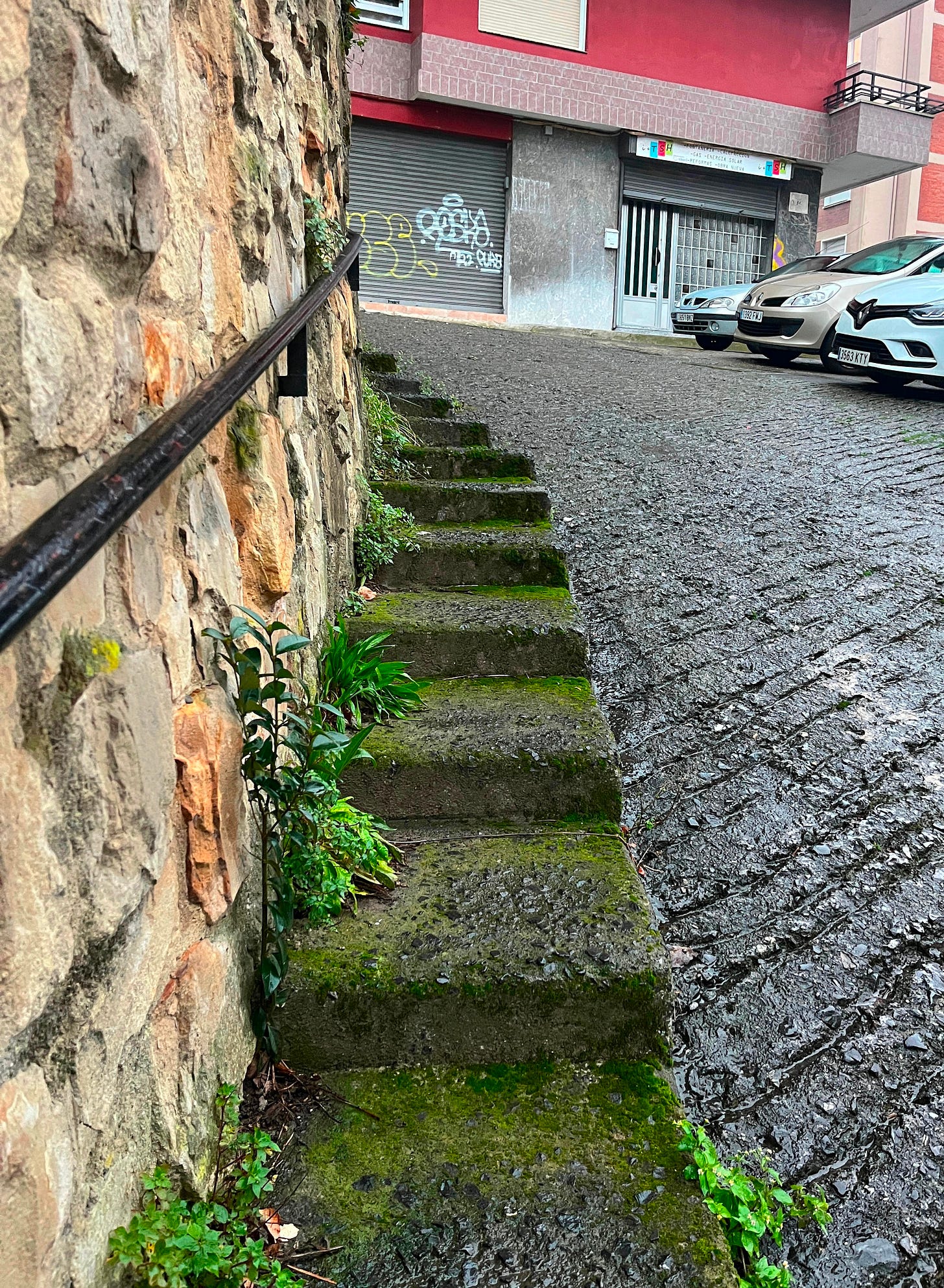 narrow stone steps along a steep narrow old road