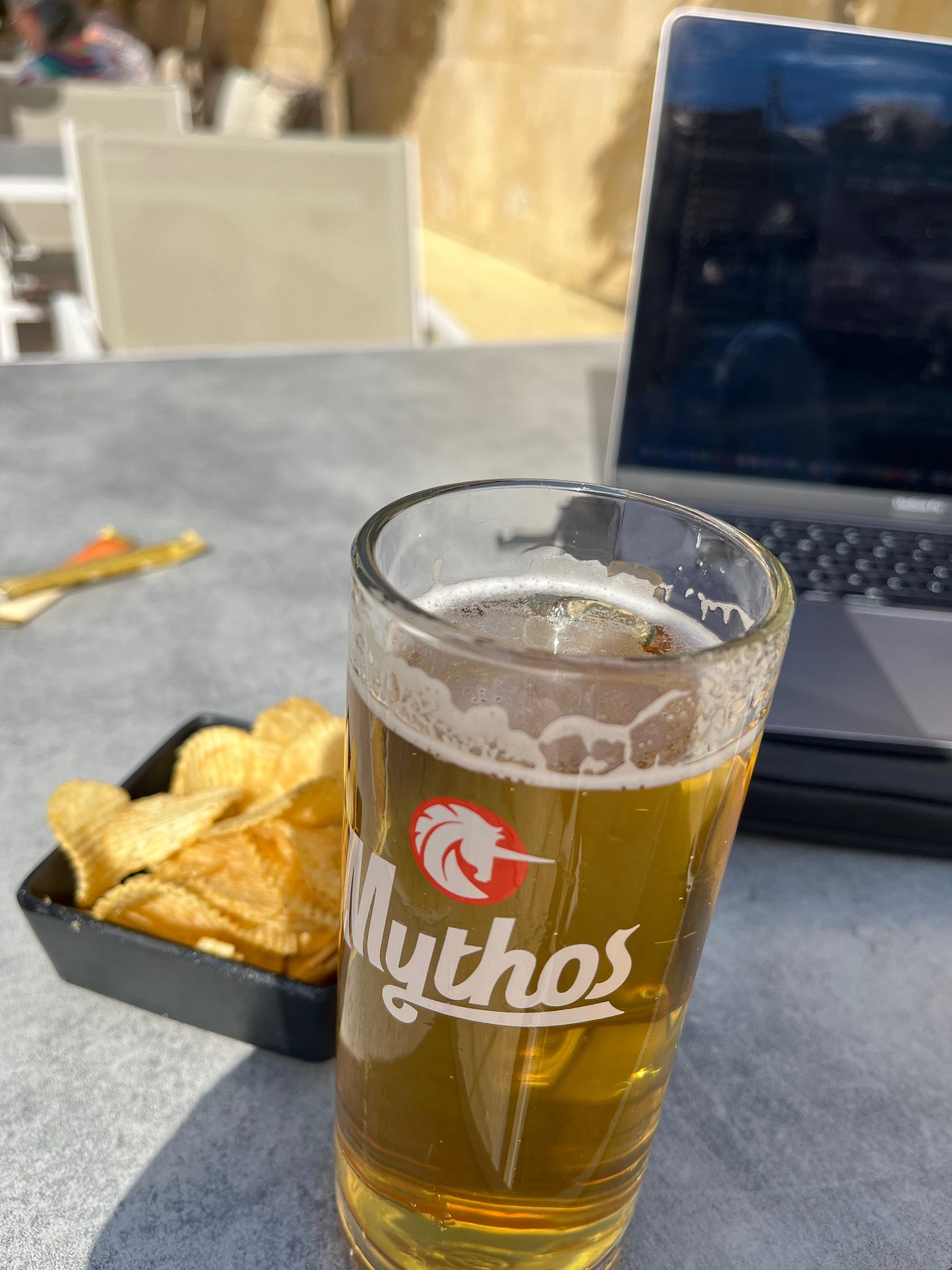 Lager and crisps next to my laptop!