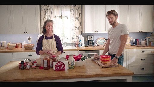 ABeline making chili in kitchen with gay Liam Keegan Allen.