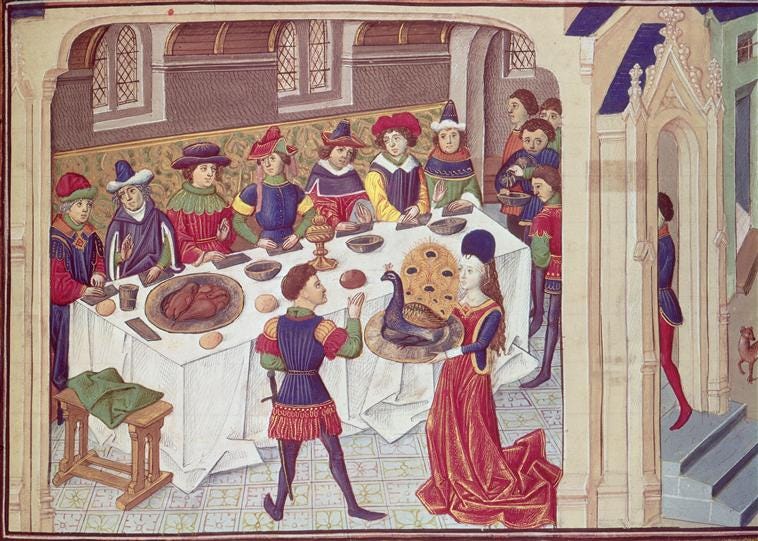 A medieval drawing of people at a feast, with a woman holding a whole peacock on a platter. A knight raises his hand to it.