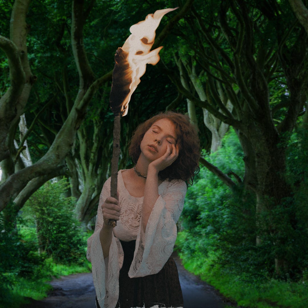 Woman in a forest path looking like she's dreaming while holding a flame